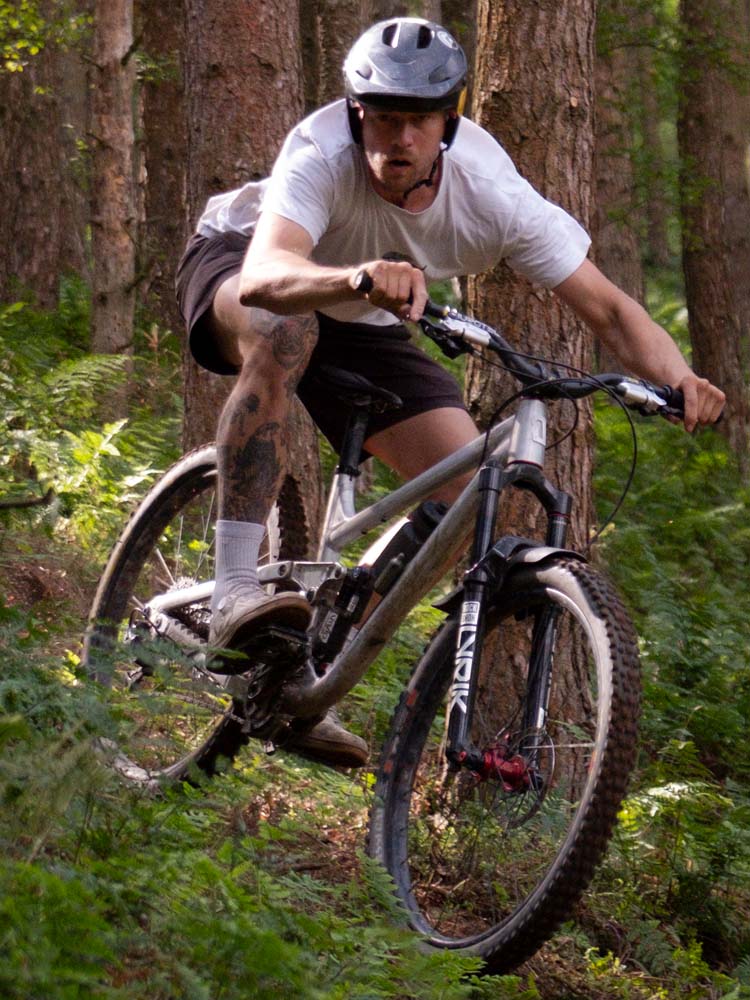 Airdrop Filter trail bike being ridden through tight, twisty singletrack