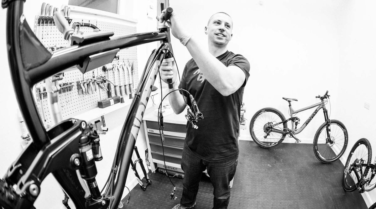Ed Brazier, owner and founder of Airdrop bikes in the original garage workshop