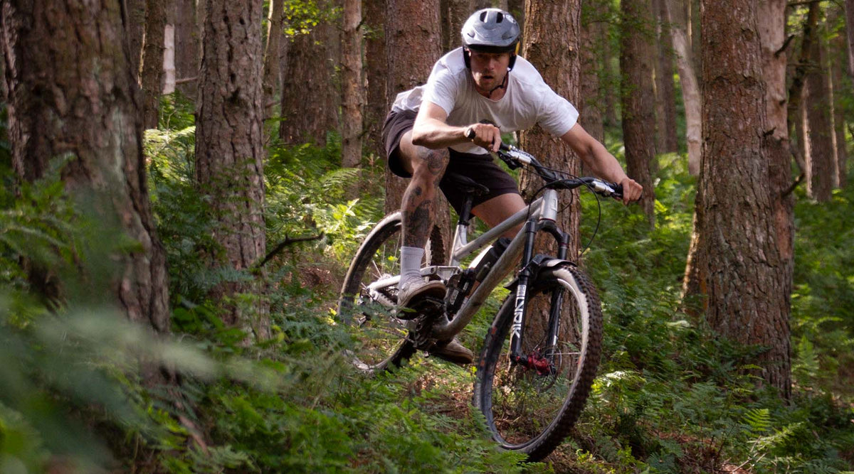 Airdrop Filter trail bike being ridden through tight, twisty singletrack